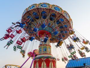 Guests riding the colorful swing ride at Jenkinson’s Boardwalk