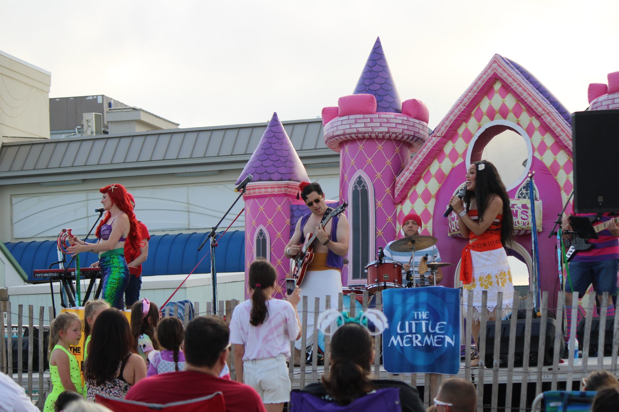 Audience enjoying live music performance on stage.