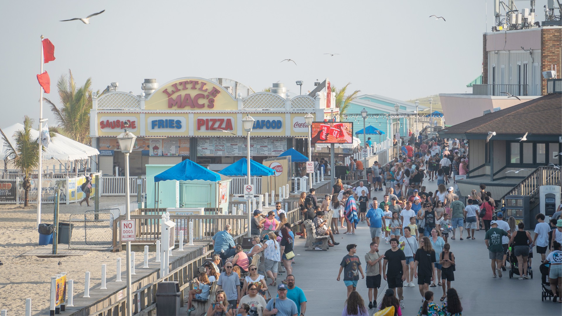 Crowds walking the Point Pleasant Beach boardwalk near Little Mac’s